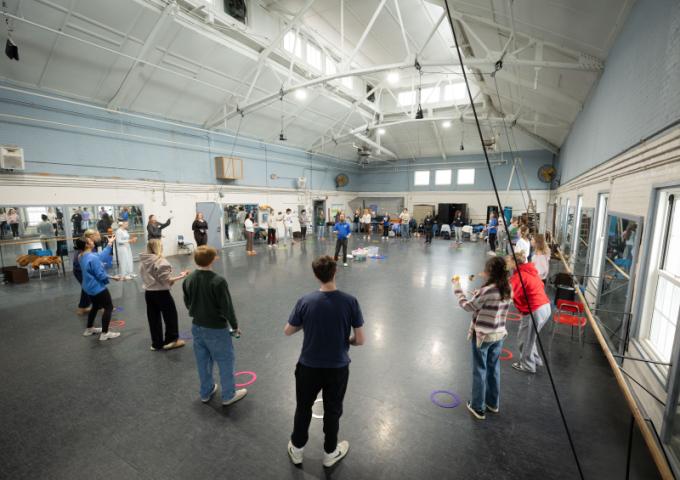 Students participating in a large circle formation
