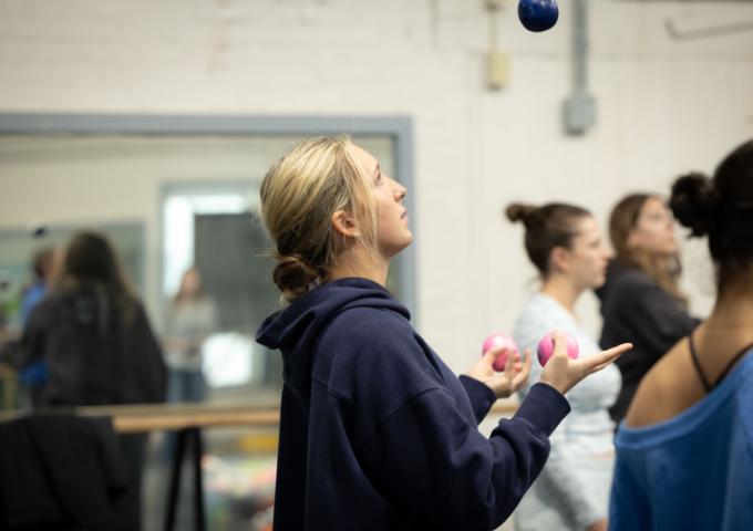 One student focused on juggling multiple balls