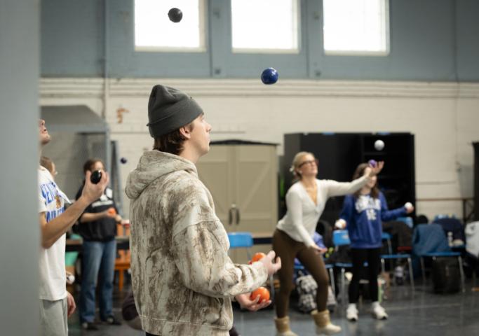 A few students attempting to juggle