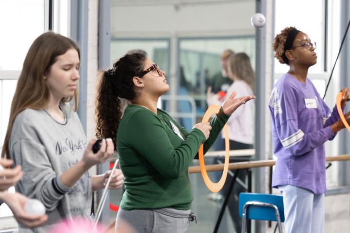 Students working with hoops and balls
