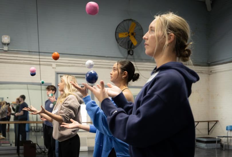 Students learning to juggle multiple balls at once